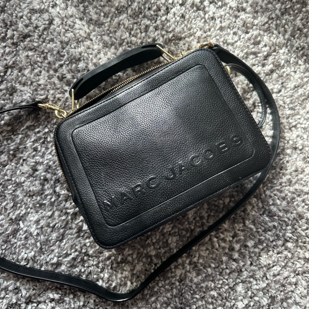 Marc Jacobs box bag. They don’t sell this specific bag anymore. Very chic